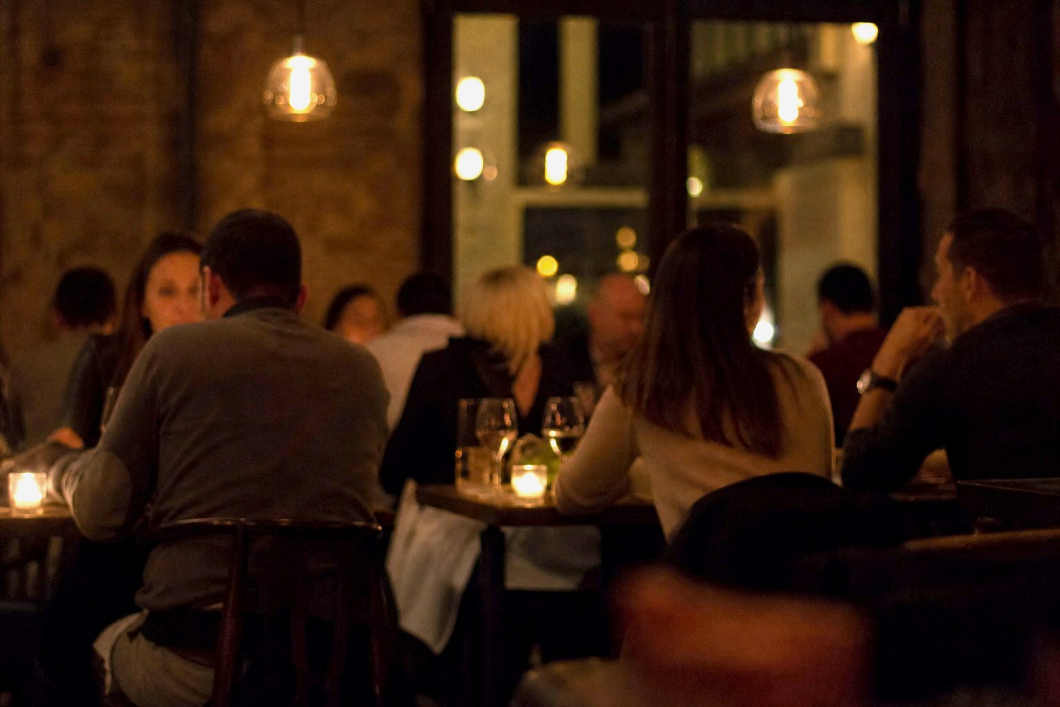 Guests at the tables after dark.