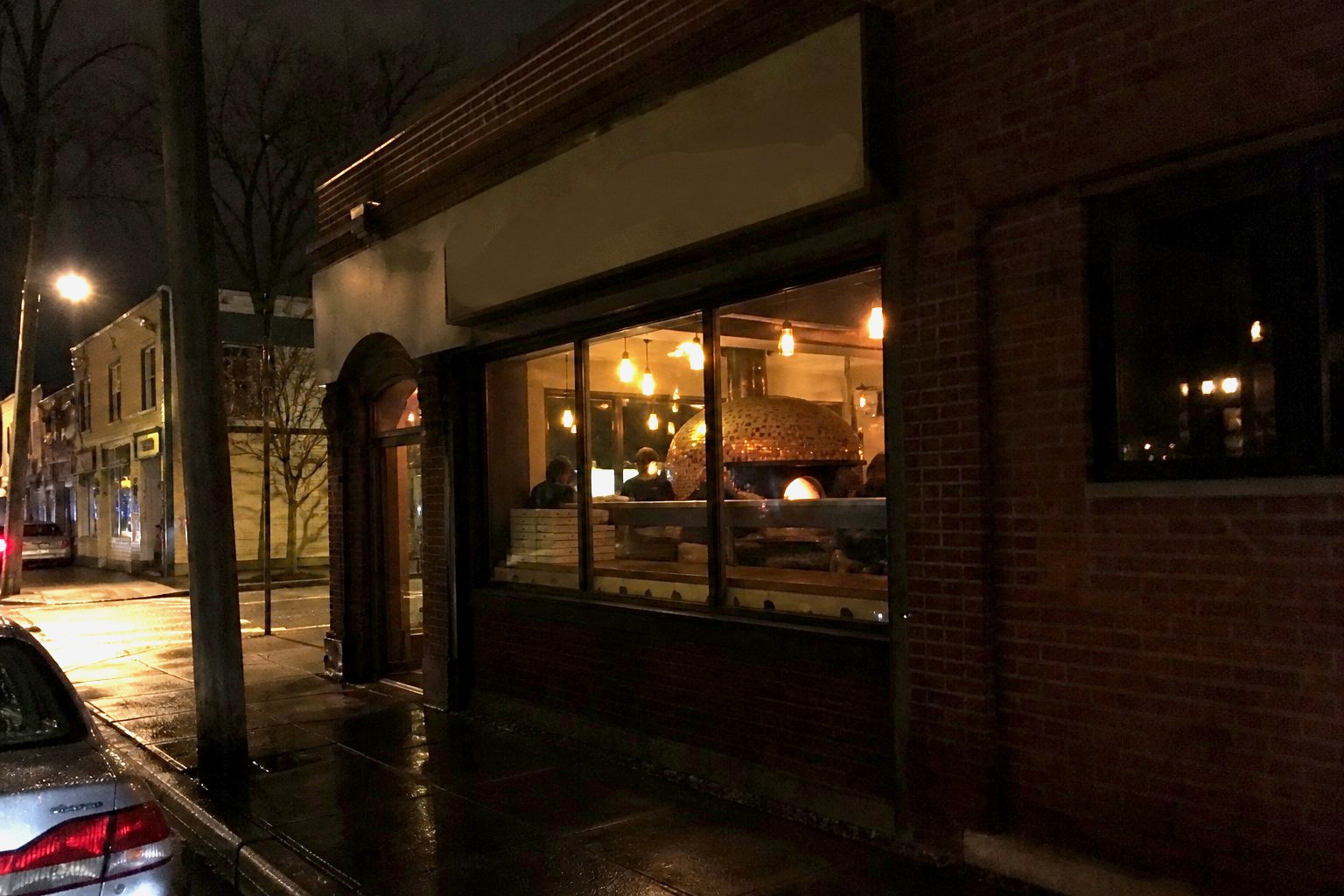 The storefront at night.
